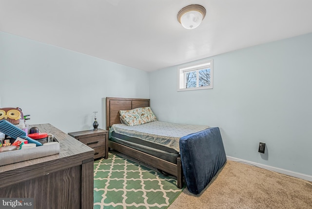 carpeted bedroom with baseboards