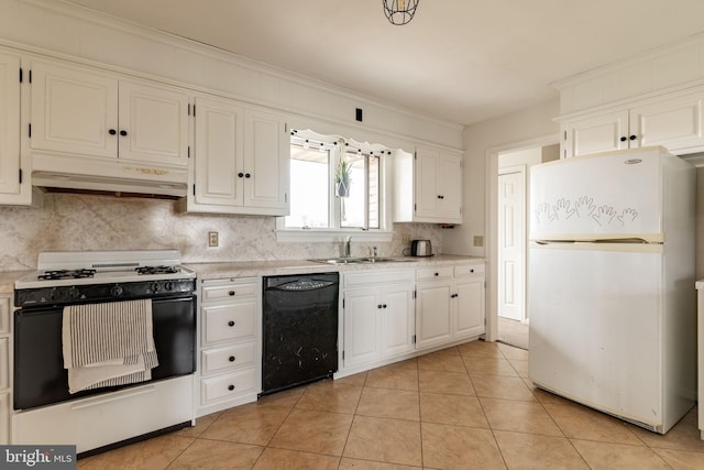 kitchen featuring range with gas stovetop, freestanding refrigerator, a sink, black dishwasher, and under cabinet range hood