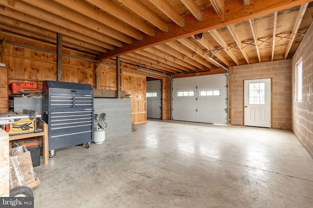 garage with concrete block wall