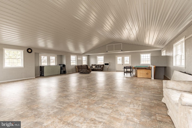 unfurnished living room featuring french doors and lofted ceiling