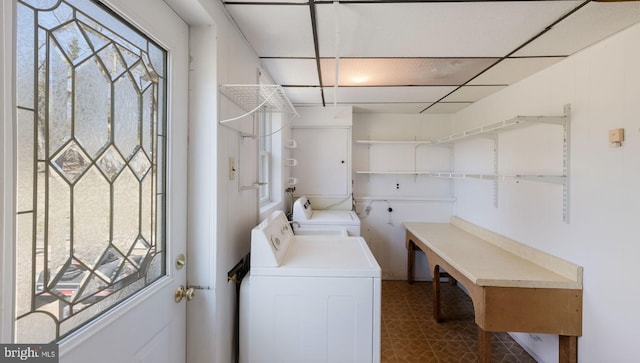 laundry room featuring plenty of natural light, laundry area, and washer and clothes dryer