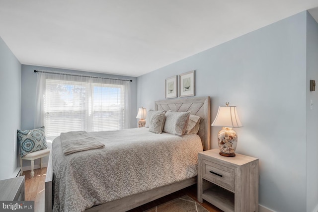 bedroom with wood finished floors