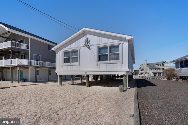 back of property featuring a carport