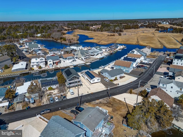 aerial view featuring a residential view and a water view