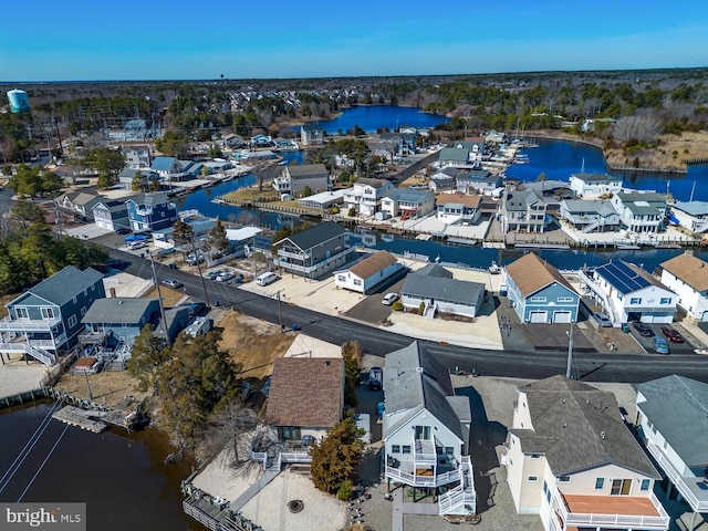 bird's eye view featuring a water view and a residential view