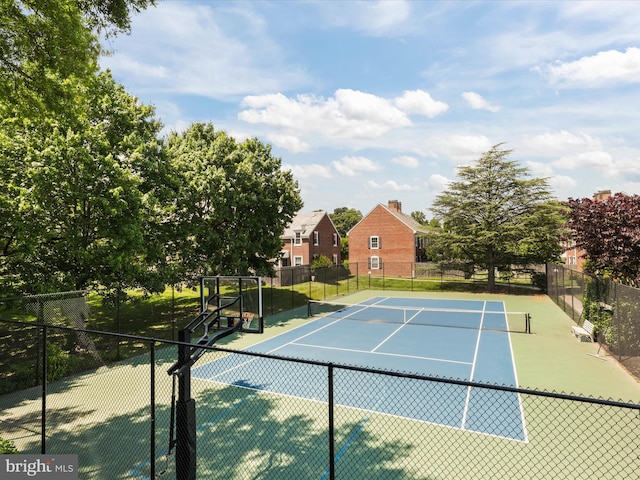 view of tennis court with fence