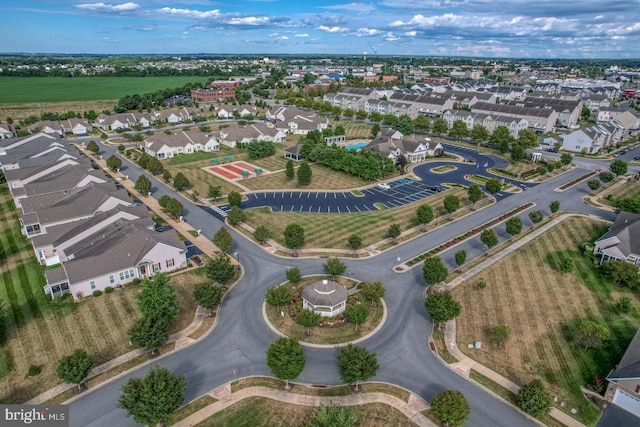 birds eye view of property with a residential view