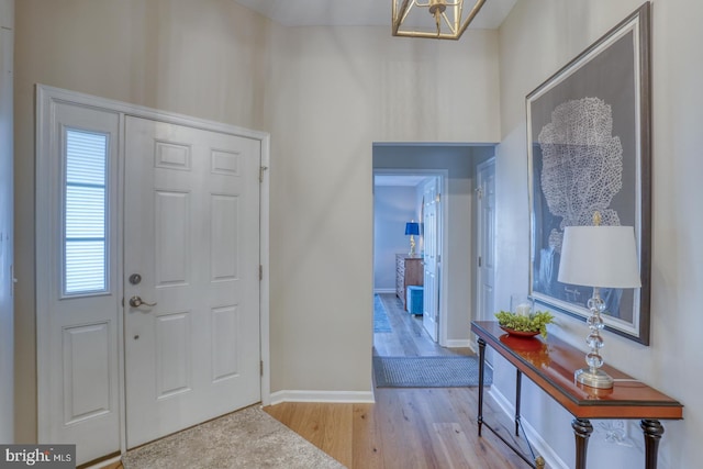 entrance foyer with wood finished floors and baseboards