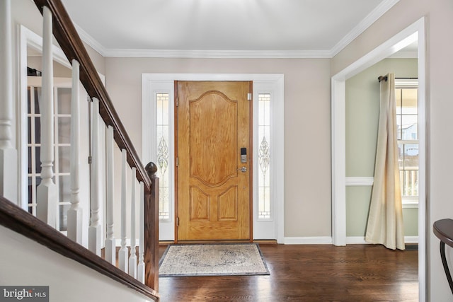 entryway featuring stairs, baseboards, dark wood-type flooring, and crown molding