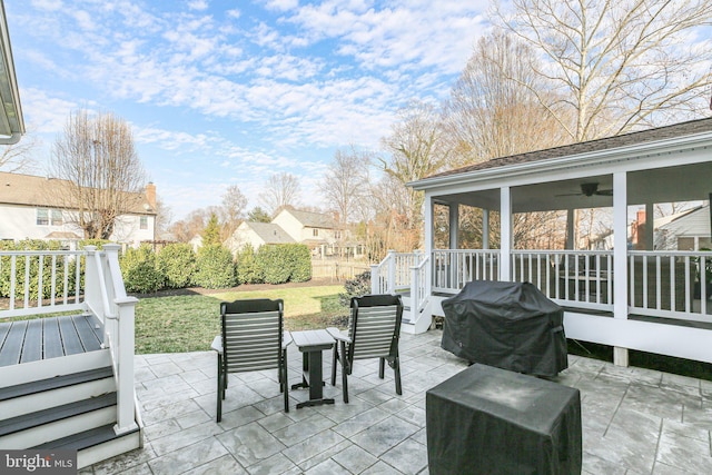 view of patio / terrace featuring a grill, a ceiling fan, and fence