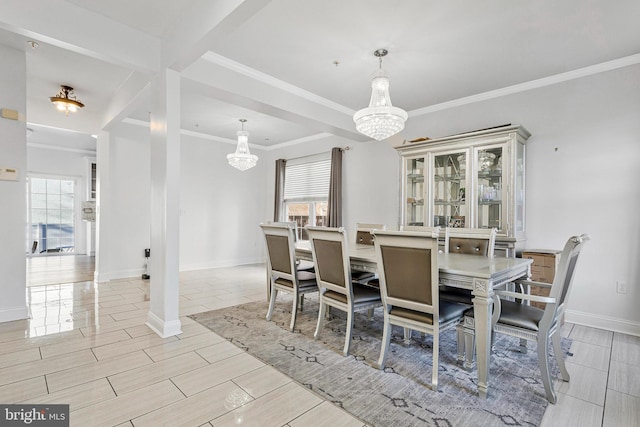 dining room featuring baseboards, a chandelier, wood tiled floor, and ornamental molding