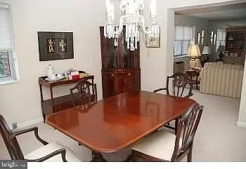 dining room featuring a notable chandelier