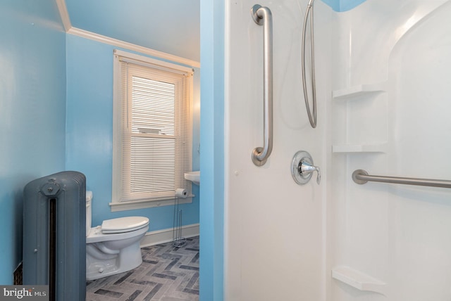 full bath featuring baseboards, radiator, walk in shower, and toilet