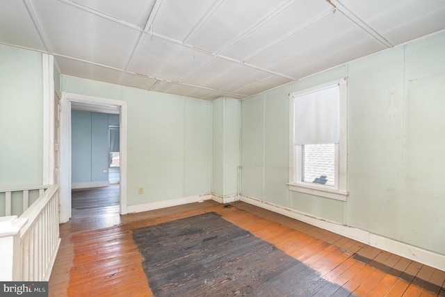 spare room featuring hardwood / wood-style floors