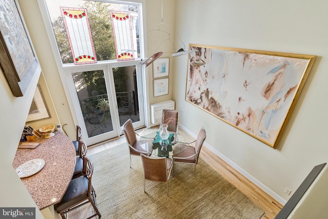 dining room featuring baseboards and wood finished floors