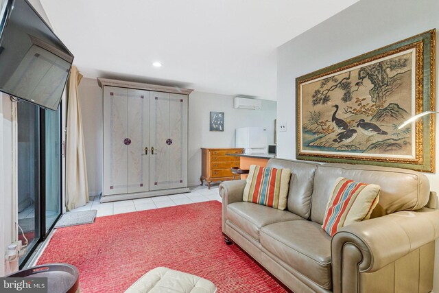 living room featuring a wall unit AC, light tile patterned flooring, and recessed lighting