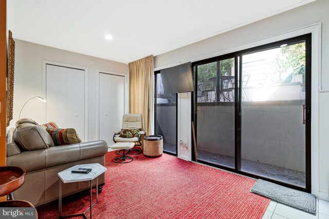 living room with tile patterned floors and recessed lighting