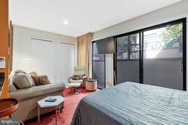 bedroom with recessed lighting and two closets