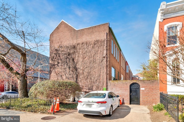 view of building exterior with a fenced front yard