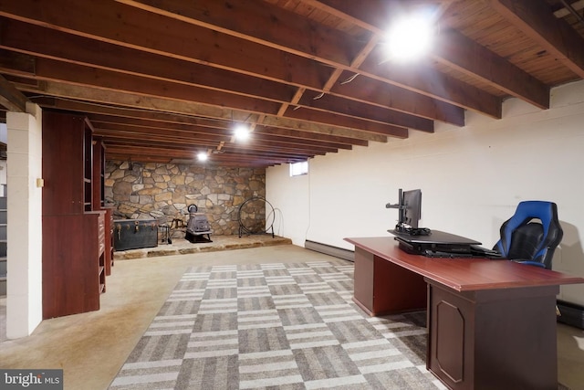 unfurnished office featuring light carpet and beamed ceiling