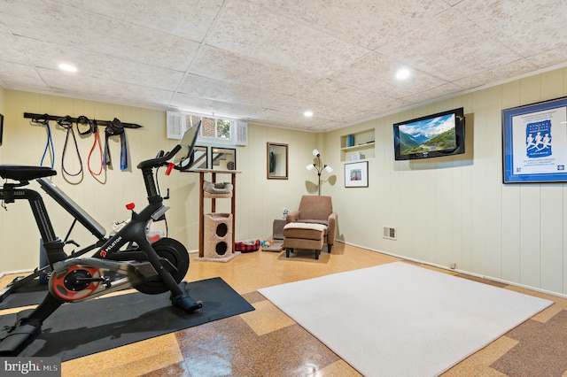 workout area featuring recessed lighting and baseboards