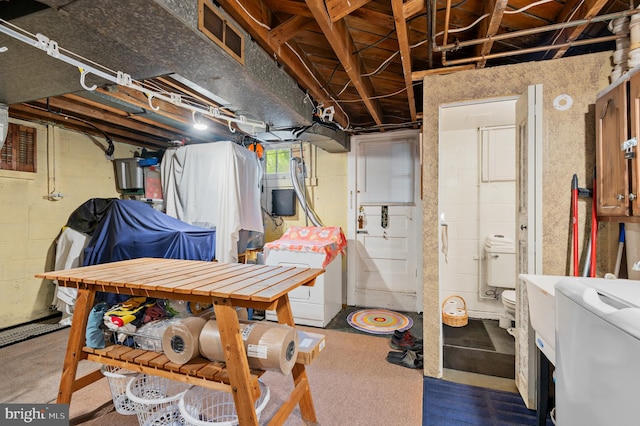 basement featuring washer / dryer and visible vents