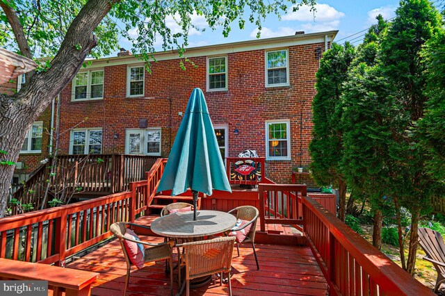 wooden deck with outdoor dining area