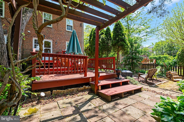 deck featuring a patio, fence, and a pergola