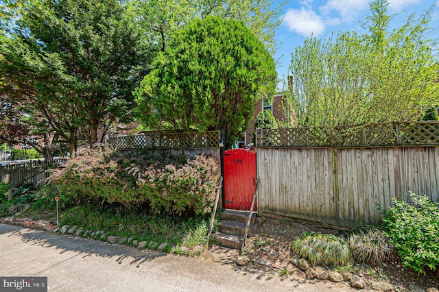 view of yard with a gate and fence