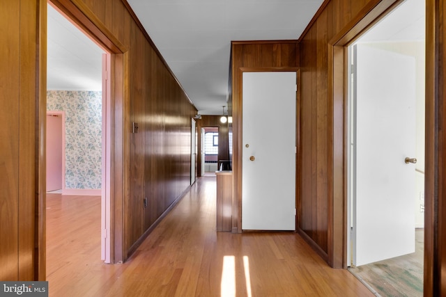 hallway featuring wallpapered walls and light wood finished floors