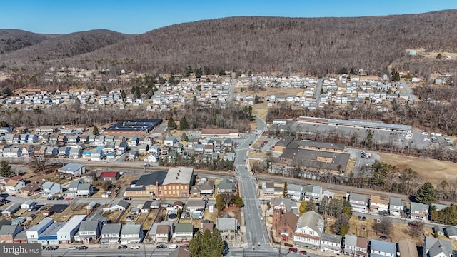 birds eye view of property featuring a mountain view and a residential view