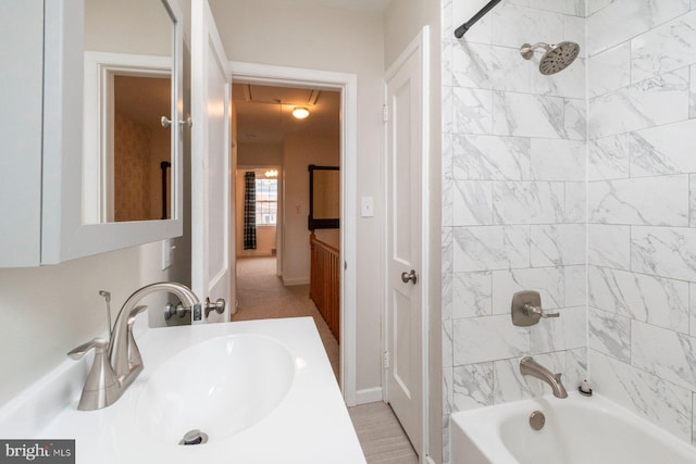 full bath featuring vanity and shower / bathtub combination