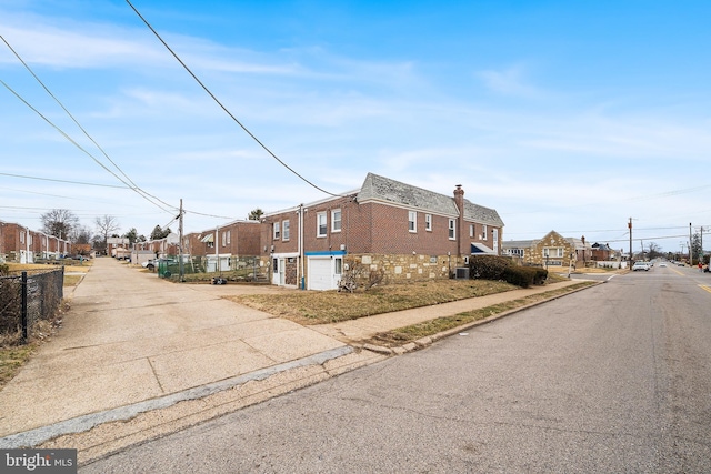 view of street with a residential view and sidewalks