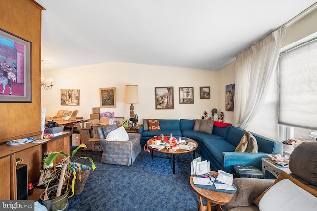 living area featuring a notable chandelier, carpet, and vaulted ceiling