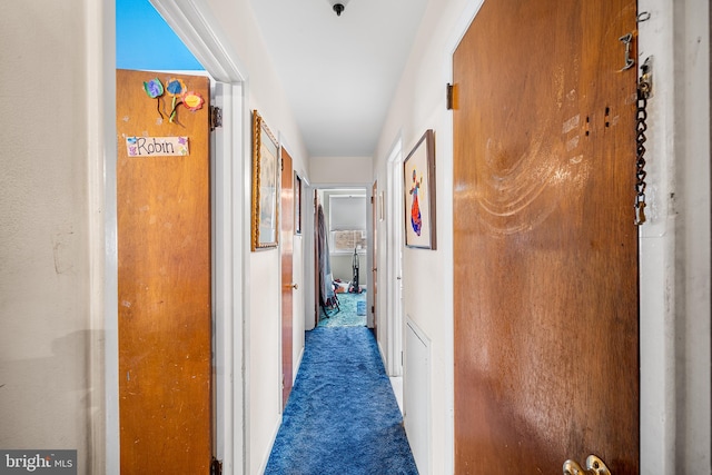 hallway featuring carpet