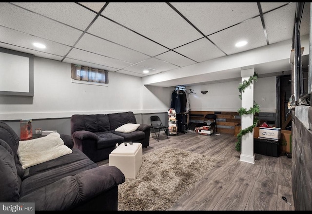 living room featuring recessed lighting, wood finished floors, and a drop ceiling