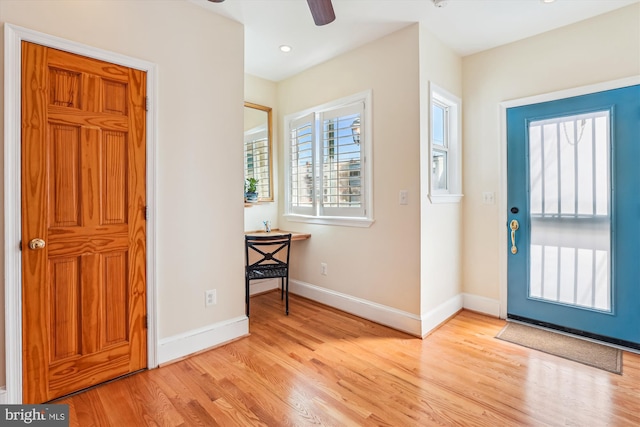 entryway featuring ceiling fan, baseboards, light wood-style flooring, and recessed lighting