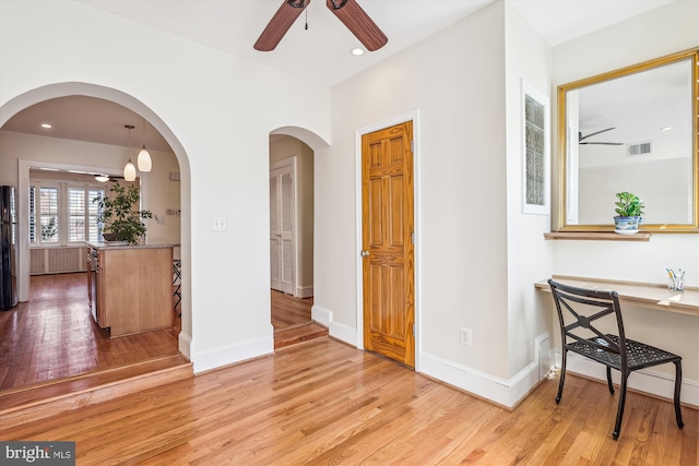 interior space with visible vents, baseboards, and light wood-style flooring