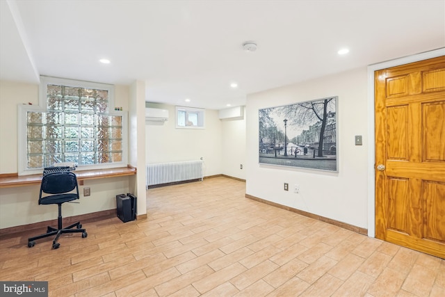 home office with radiator, wood finished floors, built in study area, recessed lighting, and an AC wall unit