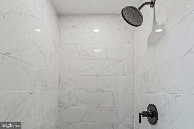 details featuring a tile shower