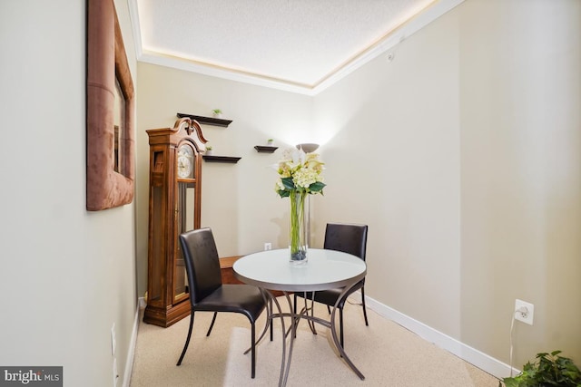 dining area featuring baseboards and ornamental molding