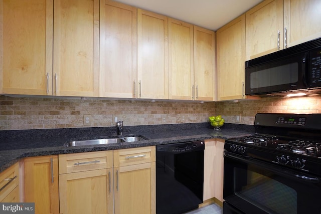 kitchen with backsplash, light brown cabinets, black appliances, and a sink