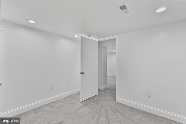 spare room featuring recessed lighting, baseboards, visible vents, and carpet floors