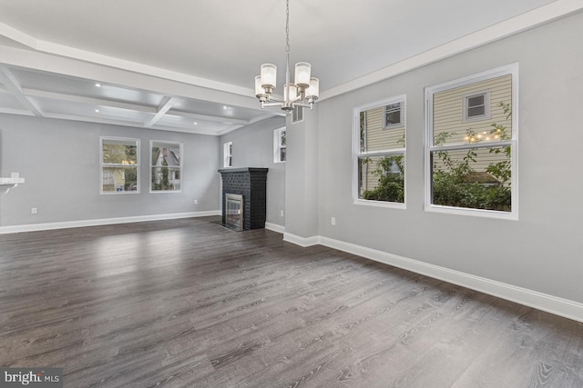 unfurnished living room with a healthy amount of sunlight, a fireplace, dark wood-type flooring, and baseboards