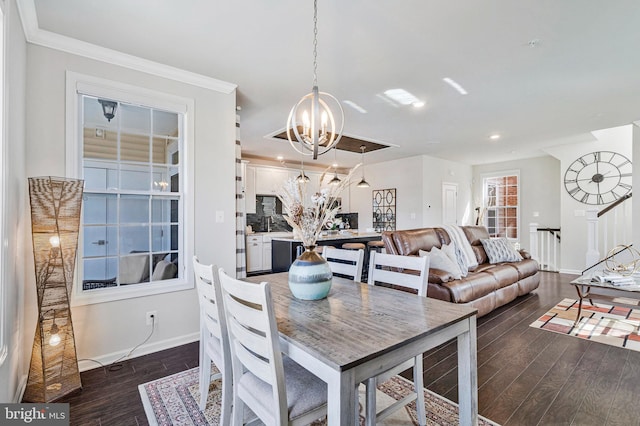 dining area with baseboards, recessed lighting, dark wood-type flooring, crown molding, and a notable chandelier