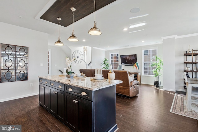 kitchen featuring ornamental molding, baseboards, and dark wood-style flooring