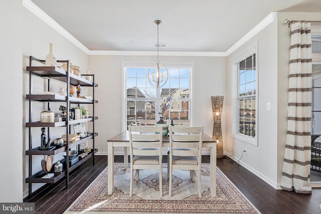 dining space with baseboards, an inviting chandelier, dark wood-style floors, and crown molding