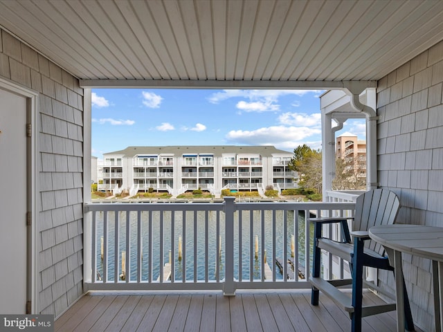 wooden deck featuring a water view