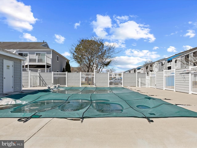 view of swimming pool with a patio, fence, and a fenced in pool
