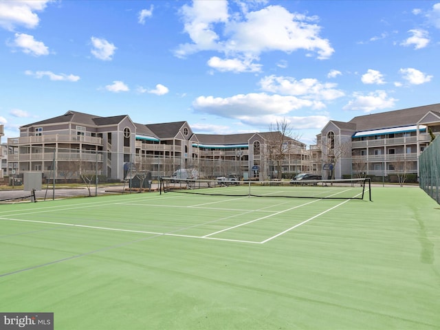 view of sport court with fence
